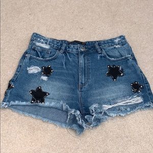 Distressed Denim Shorts with Black Stars